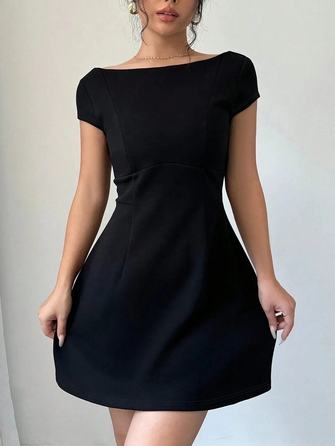 Classic Short-Sleeve Fit-and-Flare Dress with Elegant Backless Design