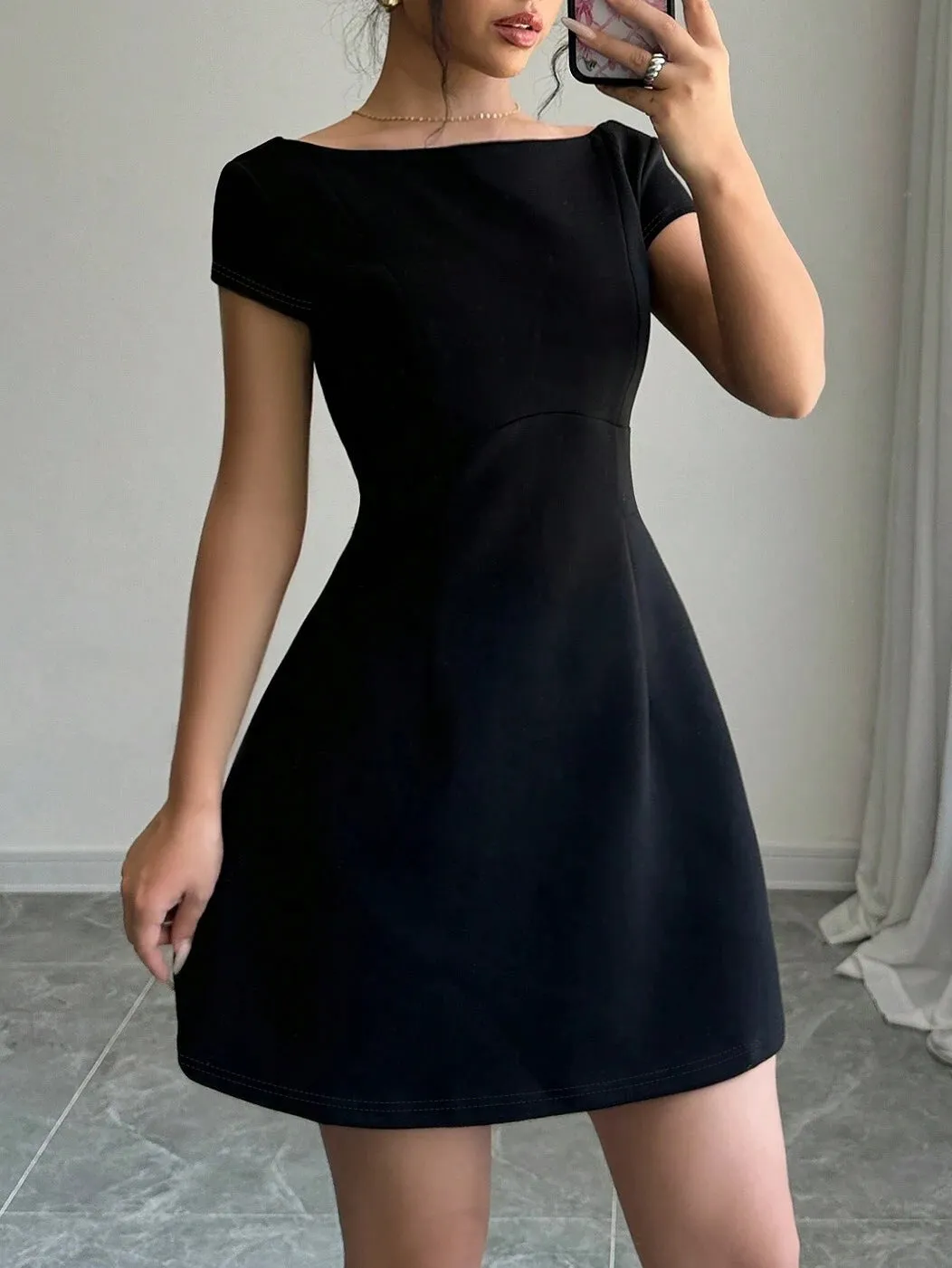 Classic Short-Sleeve Fit-and-Flare Dress with Elegant Backless Design