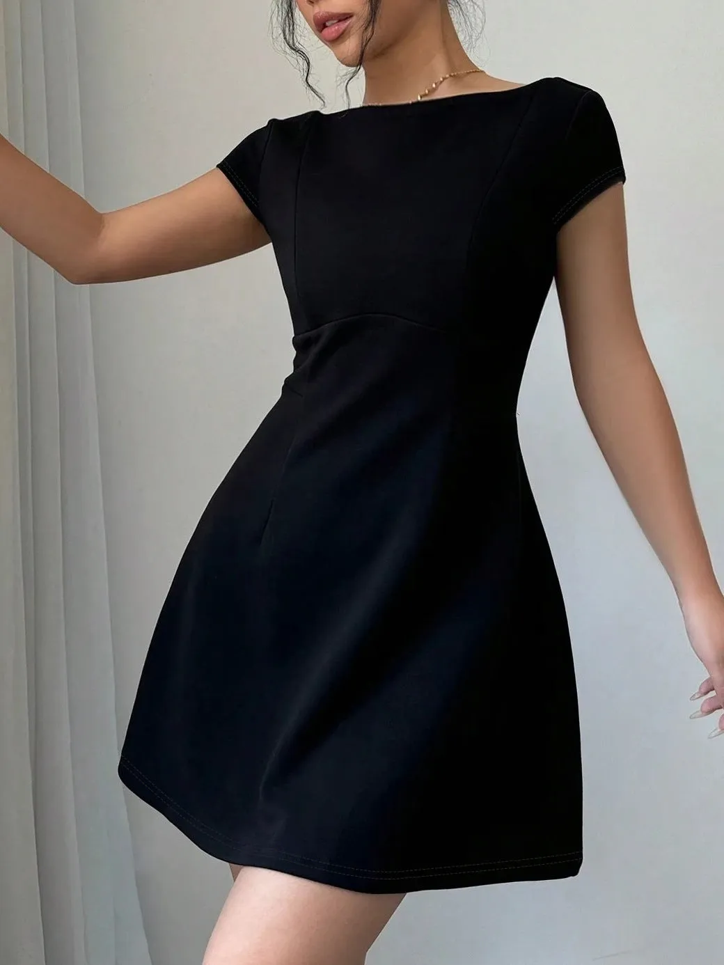 Classic Short-Sleeve Fit-and-Flare Dress with Elegant Backless Design